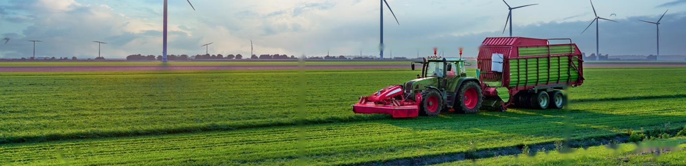 Tractor working a field in spring, powered by Shell PANOLIN Biofluid UTTO transmission fluid